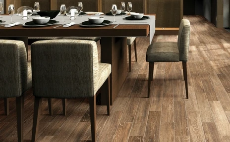 medium toned flooring in dining area
